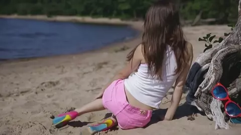 Katty Stripping and touching herself on a beach